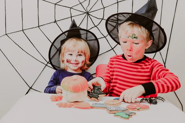 happy brother and sister on Halloween party