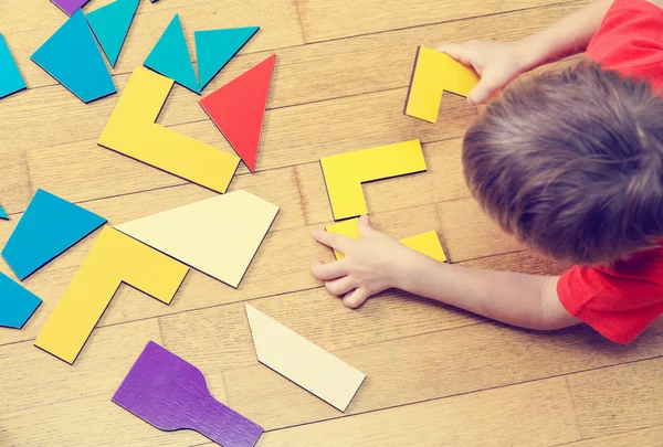 Little boy playing with puzzle, early education — Stock Photo, Image