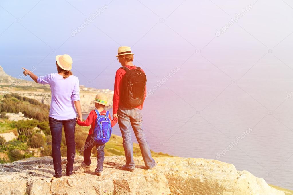 family with small kid travel in scenic mountains