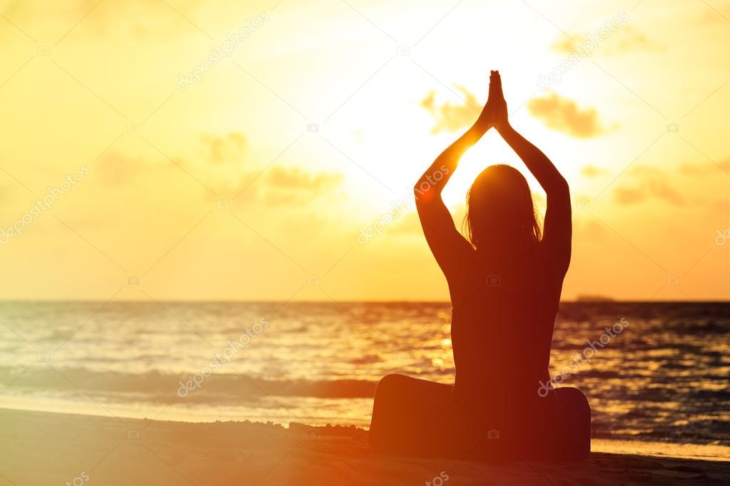 Woman meditation on the beach