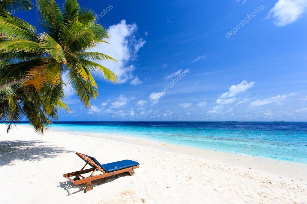Beach chair on perfect tropical sand beach