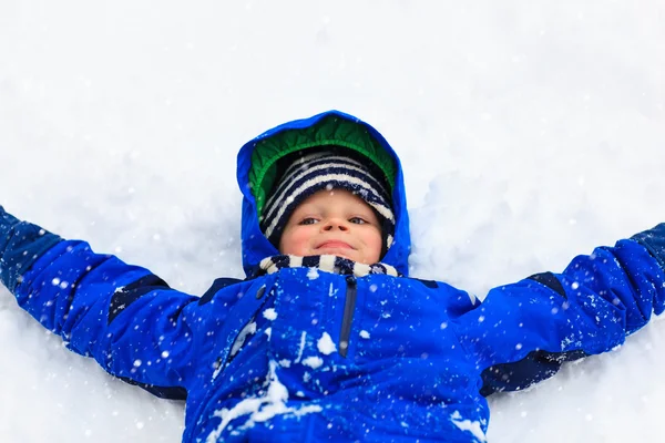 Little boy having fun in snow — Stock Photo, Image