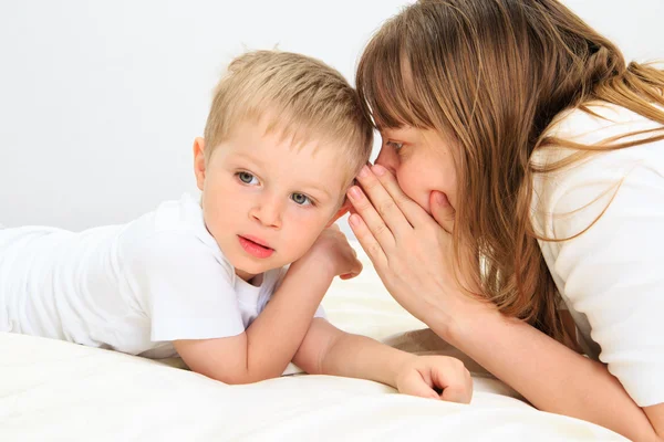 Mother and son sharing secret — Stock Photo, Image