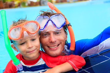 happy father and son snorkeling making selife
