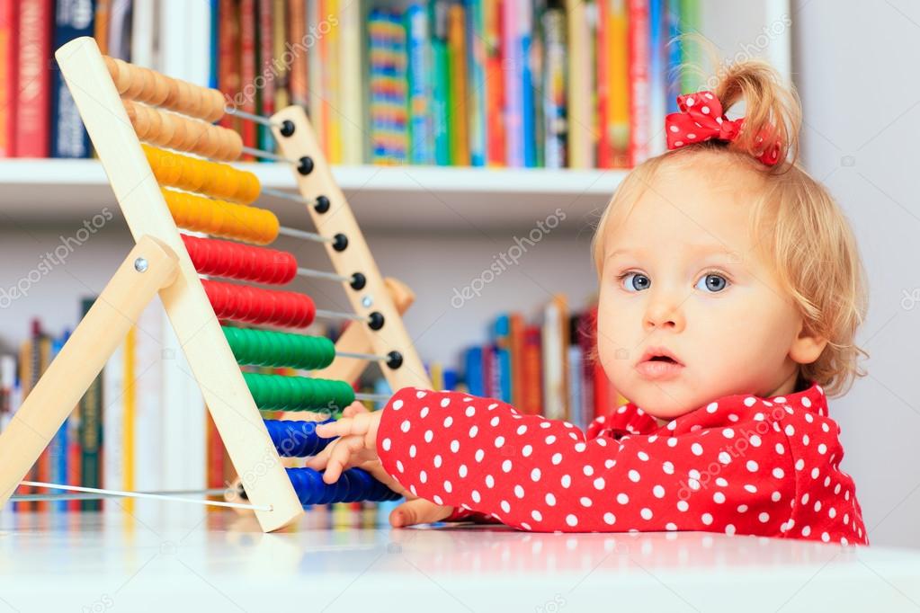 little girl playing with abacus, early learning