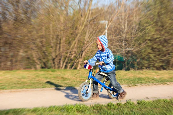 Little boy on running bike outdoors, kids sport — Stock Photo, Image