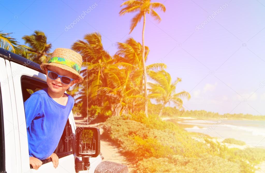 little boy in off road car, family vacation