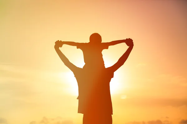 Father and son having fun at sunset — Stock Photo, Image