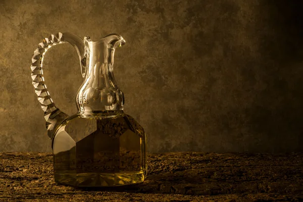 Extra virgin olive oil in vintage glass oil jar — Stock Photo, Image