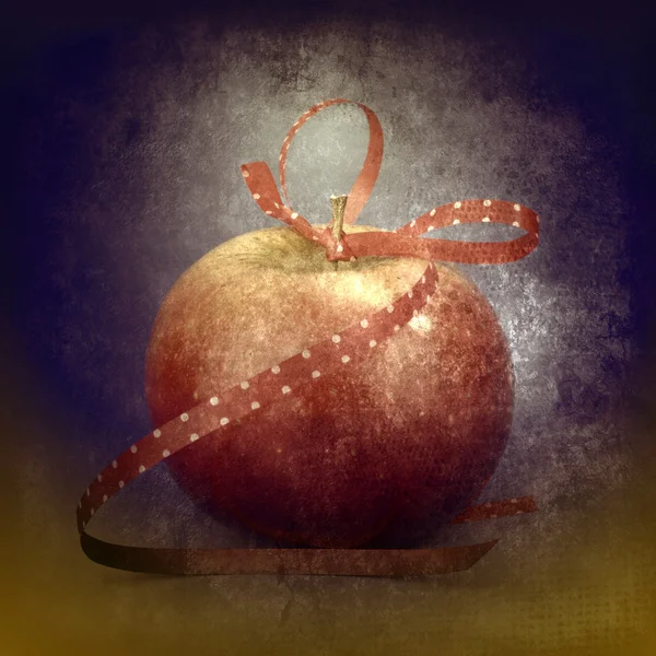 Manzana roja con cinta de regalo — Foto de Stock