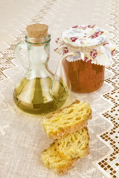 Virgin olive oil, canned tomatoes and bread — Stock Photo, Image