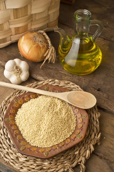 Millet and olive oil rustic background