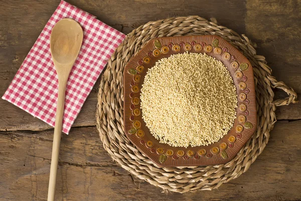 Millet on rustic background — Stock Photo, Image