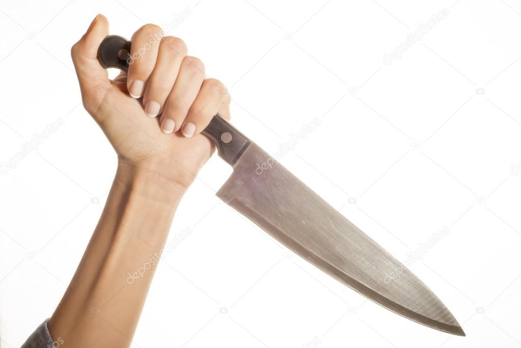 Knife in hand ready to stab isolated