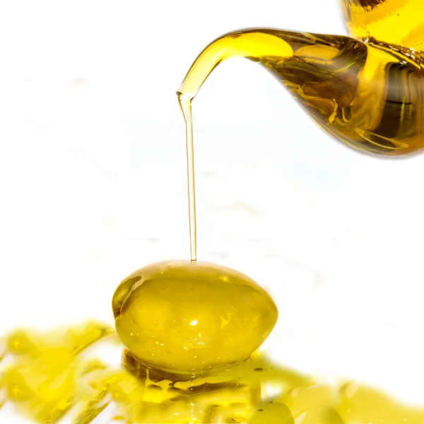 Extra olive oil falling — Stock Photo, Image