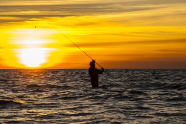 Angler in Autumn sunset clipart