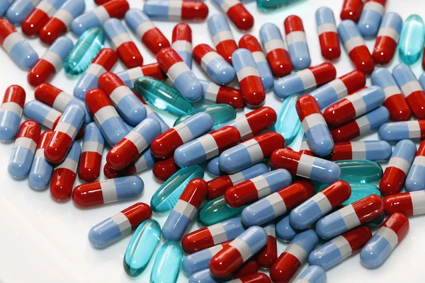 Assorted red-blue capsules — Stock Photo, Image