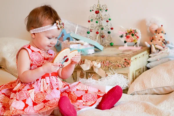 Little girl with a gifts — Stock Photo, Image