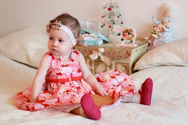 Little girl with a gifts — Stock Photo, Image