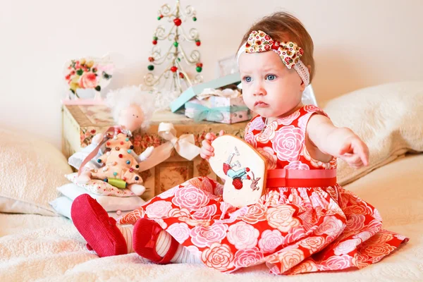 Little girl with a gifts — Stock Photo, Image