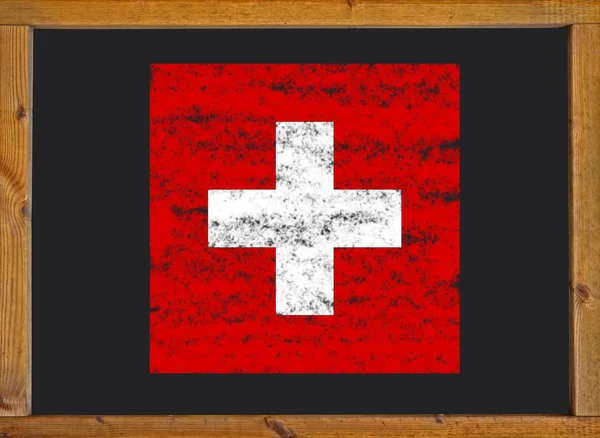 Schweiz flagga på en svart tavla — Stockfoto