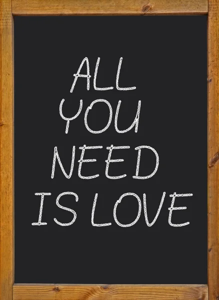 All you need is love written on a blackboard — Stock Photo, Image