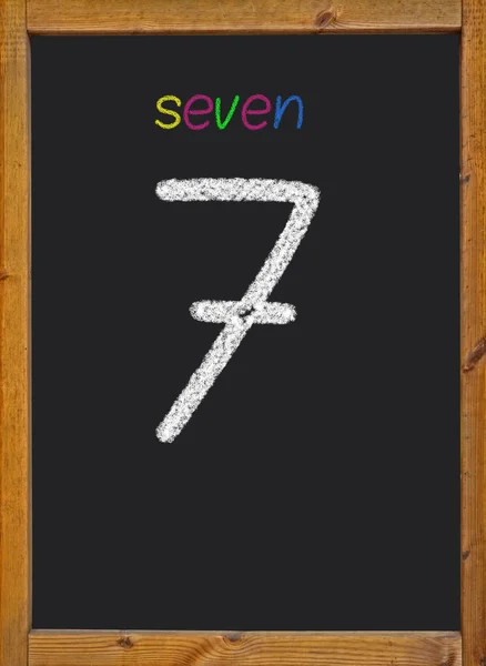 7 written on a black blackboard — Stock Photo, Image