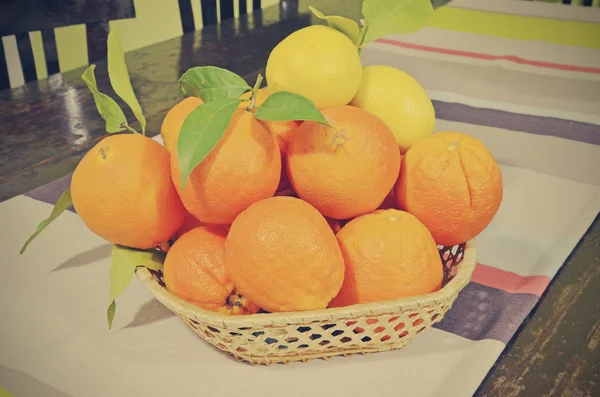 Center table with oranges and lemons — Stockfoto