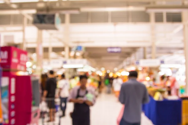 Abstracto borroso gente de compras en feria del mercado . — Foto de Stock
