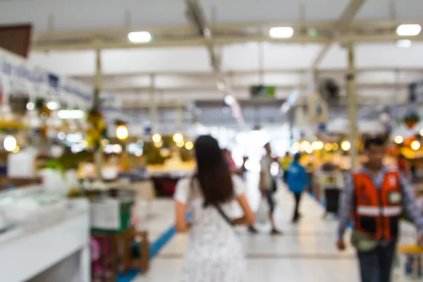 Abstracto borroso gente de compras en feria del mercado . — Foto de Stock