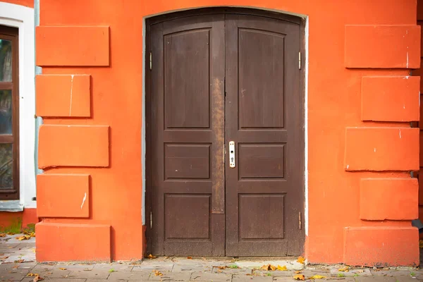 Brown Old Door Orange Concrete Wall Stock Picture