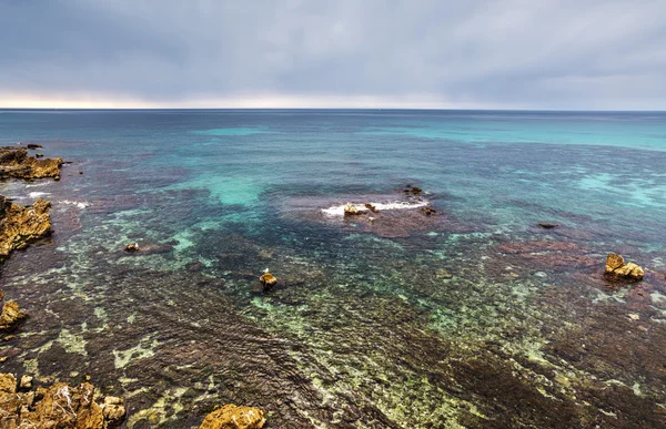 Blå havet vid solnedgången i Alghero — Stockfoto