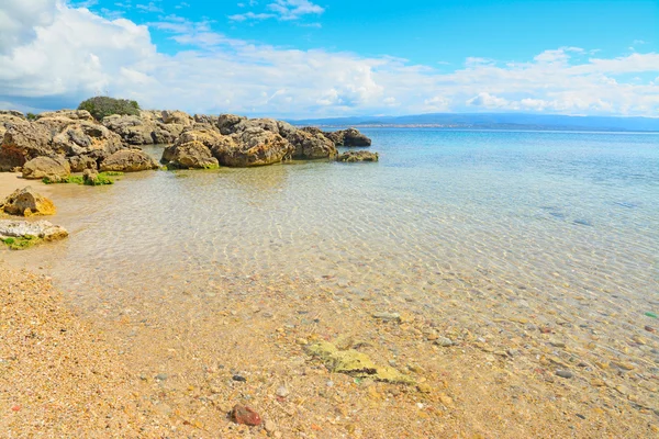 Rochas e areia em Alghero shore — Fotografia de Stock