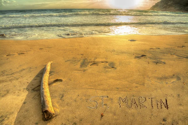 St. martin writing bei untergang — Stockfoto