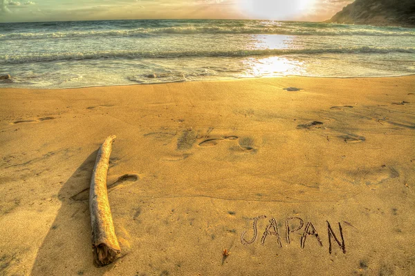 Japan skriver på en gyllene strand — Stockfoto