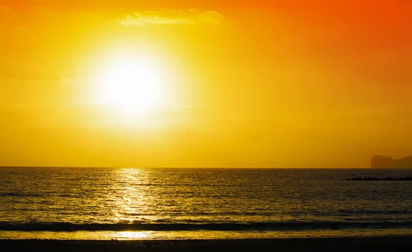 Orange and yellow sunset over Capo Caccia — Stock Photo, Image