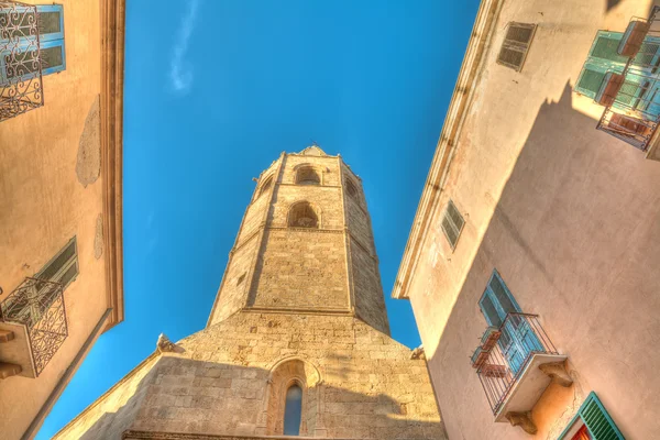 Alghero Duomo steeple under a blue sky — Stock Photo, Image