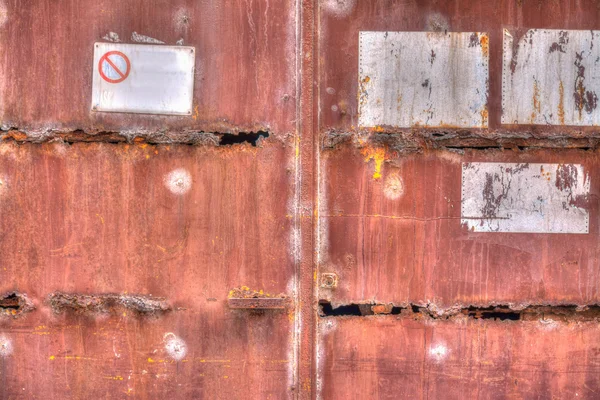 Old rusty gate with signs — Stock Photo, Image