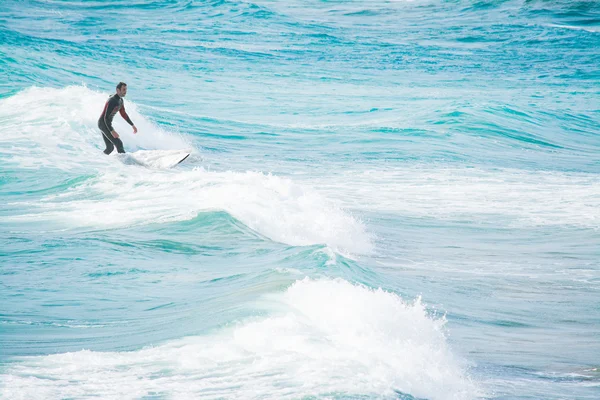 Surfing on white and blue waves — Stock Photo, Image