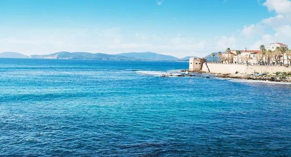 Alghero coastline under a cloudy sky — Stock Photo, Image