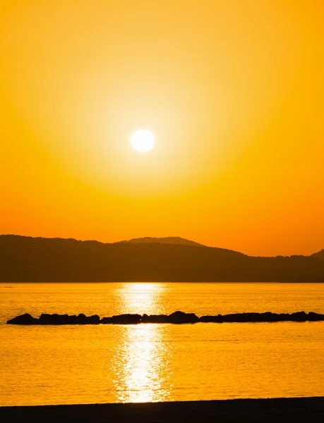 Orange solnedgång i alghero shore — Stockfoto