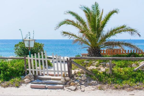 Small gate by a tropical beach — Stock Photo, Image