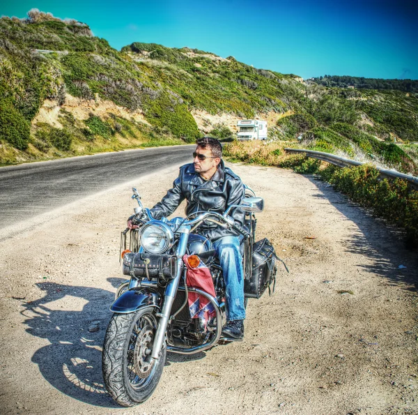 Biker and motorcycle in hdr — Stock Photo, Image