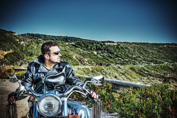 Biker on a classic motorcycle in vintage tone — Stock Photo, Image