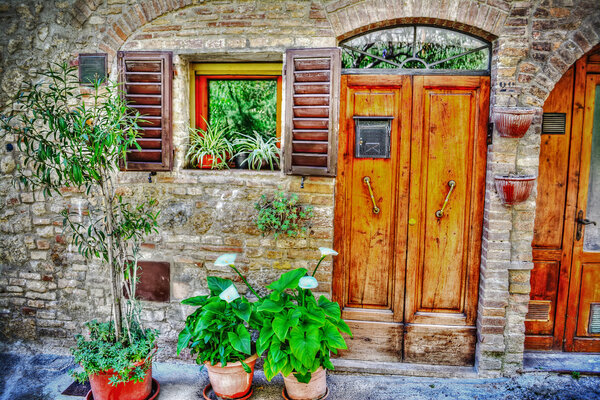 Picturesque facade of a San Gimignano house, Italy