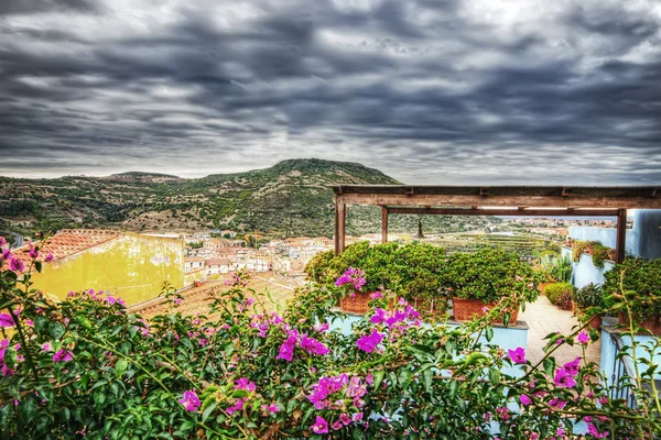 Bosa under a dramatic sky in hdr — Stock Photo, Image