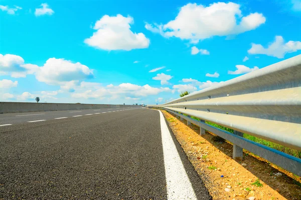 Guard rail under clouds — Stock Photo, Image