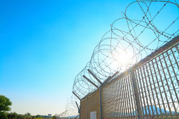 Metal fence with barbwire — Stock Photo, Image