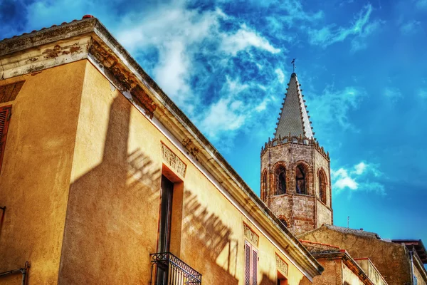 Duomo steeple under clouds in Alghero — Stock Photo, Image