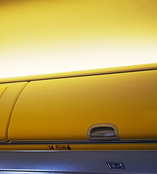 Airplane overhead luggage compartment — Stock Photo, Image